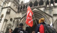 Extinction Rebellion climate change activists gather outside the Royal Courts of Justice in London, October 24, 2019. Thomson Reuters Foundation / Laurie Goering