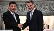 Chinese President Xi Jinping (L) and Greek Prime Minister Kyriakos Mitsotakis shake hands after their meeting at the Maximos Mansion in Athens, Greece November 11, 2019. Aris Messinis/Pool via Reuters 