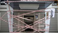 A picture taken on on November 11, 2019, shows an ATM which has been sealed by Lebanese anti-government protesters in the capital Beirut during a rally against the banking system. AFP / Patrick Baz