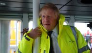 Britain's Prime Minister Boris Johnson leans on a pole in the steering cabin of a tugboat during a general election campaign stop in the port of Bristol, Britain November 14, 2019. Frank Augstein/Pool via REUTERS