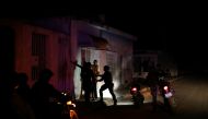 Members of the Special Action Force of the Venezuelan National Police (FAES) question a person during a night patrol, in Barquisimeto, Venezuela September 20, 2019. Reuters/Ivan Alvarado
 