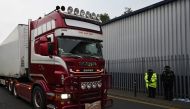 In this file photo taken on October 23, 2019 Police officers drive away a lorry in which 39 dead bodies were discovered sparking a murder investigation at Waterglade Industrial Park in Grays, east of London, on October 23, 2019. AFP / Ben STANSALL