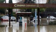 Partially submerged cars are seen in a flooded gas station after heavy rainfall in Le Muy, France, November 24, 2019. REUTERS/Eric Gaillard