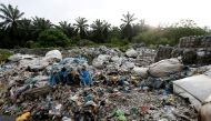 FILE PHOTO: FILE PHOTO: Scrap from an illegal plastic recycling factory are dumped near a palm oil plantation in Jenjarom, Kuala Langat, Malaysia October 14, 2018. Picture taken October 14, 2018. REUTERS/Lai Seng Sin/File Photo/File Photo