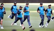 Pakistan player Mohammad Abbas (C) and teammates take part in a training session on the eve of the second cricket Test match between Australia and Pakistan, in Adelaide on November 28, 2019. --  / AFP / William WEST / 