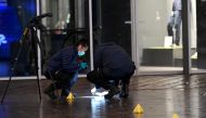 Forensics officers work near the site of a stabbing on a shopping street in The Hague, Netherlands November 29, 2019. REUTERS/Piroschka van de Wouw