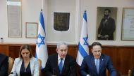 Israeli Prime Minister Benjamin Netanyahu, Minister for Social Equality Gila Gamliel (L) and Cabinet Secretary Tzachi Braverman (R) attend the weekly cabinet meeting at Netanyahu's office in Jerusalem in Jerusalem December 1, 2019. Abir Sultan/Pool via Re