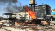A burning gas tank at the scene of a fire at a tile manufacturing unit in an industrial zone in sudan's north Khartoum. December 3, 2019 / AFP / Ebrahim HAMID