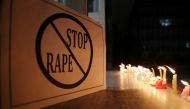 A poster is seen at a candle-lit march by the resident doctors and medical students from All India Institute Of Medical Sciences (AIIMS) to protest against the alleged rape and murder of a 27-year-old woman on the outskirts of Hyderabad, in New Delhi, Ind