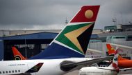 FILE PHOTO: The logo of South African Airways (SAA) is seen on an aircraft at O.R. Tambo International Airport in Johannesburg, South Africa, February 14, 2019. REUTERS/Mike Hutchings 