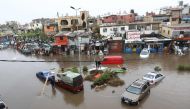 Cars are stuck after breaking down on a flooded road due to heavy rain, at the southern entrance of the Lebanese capital Beirut on December 9, 2019. / AFP / Anwar AMRO