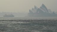 The Sydney Opera House can be seen as smoke haze from bush fires in New South Wales blankets the CBD in Sydney, Australia, December 10, 2019. AAP Image/Joel Carrett/via REUTERS 