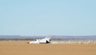 The jet-propelled British Bloodhound LSR (Land Speed Record) car drives at about 900km/h, on November 15, 2019, during preliminary tests at Hakskeenpan in the Northern Cape Province. AFP / Rodger Bosch 