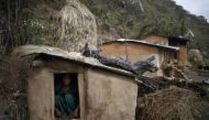 In this 2014 archive photo a 14-year old girl sits inside a Chaupadi shed in the hills of Legudsen village in Achham District in western Nepal. Reuters / Navesh Chitrakar