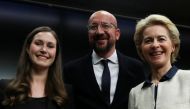 Finland's Prime Minister Sanna Marin, European Council President Charles Michel and European Commission President Ursula von der Leyen pose after a joint news conference at the end of the European Union leaders summit in Brussels, Belgium December 13, 201