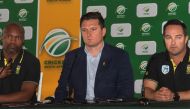 Enoch Nkwe(L), Graeme Smith(C), and Mark Boucher(R), speak during a press conference at the Newlands Cricket grounds in Newlands, on December 14, 2019. / AFP / Brenton Geach 
