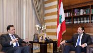Lebanese outgoing prime minister Saad Hariri meets with Prime Minister-designate Hassan Diab (L) in Beirut on December 20, 2019. AFP