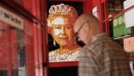 A portrait of Queen Elizabeth hangs on a wall at a  British restaurant in Manhattan on June 24, 2016. AFP / Getty Images