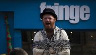 A street performer stages a show on The Royal Mile in Edinburgh, Scotland on April 11, 2019. AFP / Andy Buchanan