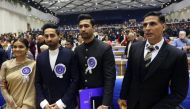 Bollywood actors and award winners Keerthy Suresh (L), Ayushmann Khurrana (2nd L), Vicky Kaushal (2nd R) and Akshay Kumar pose for a photo at the National Film Awards ceremony in New Delhi on December 23, 2019. (AFP)