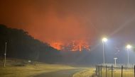 A bushfire burns near the Lithgow Correctional Centre compound in Marrangaroo, New South Wales, Australia December 19, 2019 in this picture obtained from social media. 