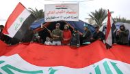 Iraqi protesters gather at Baghdad's Tahrir Square as demonstrations against the political system continues for the third consecutive month across Iraq on December 27, 2019. / AFP / AHMAD AL-RUBAYE