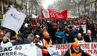 French labour union members and workers on strike attend a demonstration after 24 days of strike against French government's pensions reform plans in Paris, France, December 28, 2019. REUTERS/Benoit Tessier