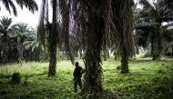 FILE PHOTO: A soldier from the the Armed Forces of the Democratic Republic of the Congo standing in position outside an FARDC camp during a patrol in Beni on November 13, 2018. AFP / John Wessels