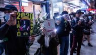 Protesters take part in a human chain rally at the Tsim Sha Tsui district of Hong Kong on December 31, 2019.  AFP / Isaac Lawrence
 