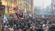 People gather at the funeral of the Iranian Major-General Qassem Soleimani, top commander of the elite Quds Force of the Revolutionary Guards, and the Iraqi militia commander Abu Mahdi al-Muhandis, who were killed in an air strike at Baghdad airport, in B