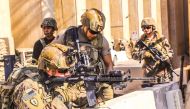 A handout picture received from the US embassy in Iraq on December 31, 2019, shows American soldiers taking position around the embassy in the capital Baghdad, after supporters and members of the Hashed al-Shaabi military network breached the outer wall o