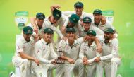 The Australian team poses with the Trans-Tasman Trophy after winning the series on the fourth day of the third cricket Test match between Australia and New Zealand at the Sydney Cricket Ground in Sydney on January 6, 2020./ AFP / JEREMY NG /