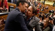 Spanish caretaker prime minister, socialist Pedro Sanchez, is congratulated by Spanish far-left Unidas Podemos coalition leader, Pablo Iglesias (R), after winning a parliamentary vote to elect a premier at the Spanish Congress (Las Cortes) in Madrid on Ja