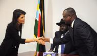 FILE PHOTO: US Ambassador to the United Nations Nikki Haley greets South Sudan's First Vice President Taban Deng Gai next to South Sudan President Salva Kiir, in Juba, South Sudan October 25, 2017. Reuters/Jok Solomun