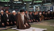 Iran Supreme Leader Ayatollah Ali Khamenei leading Friday prayers at the Grand Mosallah mosque in  Tehran while flanked by President Hassan Rouhani (C-L, behind) January 17, 2020. Office of Iran's Supreme Leader Ayatollah Ali Khamenei / AFP