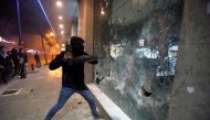 FILE PHOTO: Protesters smash the window of a bank as demonstrations against the government continue in Beirut, Lebanon January 14, 2020. REUTERS/Mohamed Azakir