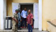 Comoros soldiers are seen in front of a polling station in the Badjanani neighbourhood in Moroni on January 19, 2020. AFP / Ibrahim Youssouf
 