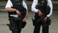 Armed police personnel patrol near London's Trafalgar Square on August 4, 2016. AFP