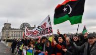 A protest with Stop war in Libya banner in front of the Reichstag building during the Peace summit on Libya at the Chancellery in Berlin on January 19, 2020. AFP / John MacDougall