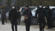 People wearing masks are seen at the Jinyintan hospital, where the patients with pneumonia caused by the new strain of coronavirus are being treated, in Wuhan, Hubei province, China January 20, 2020. REUTERS/Stringer CHINA OUT.