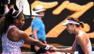 China's Wang Qiang (R) shakes hands with Serena Williams of the US after victory during their women's singles match on day five of the Australian Open tennis tournament in Melbourne on January 24, 2020. IMAGE RESTRICTED TO EDITORIAL USE - STRICTLY NO COMM