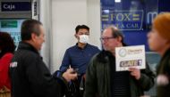 A traveler wears a surgical mask as a preventive measure in light of the coronavirus outbreak in China, after landing at Benito Juarez international airport in Mexico City, Mexico January 24, 2020. Reuters/Carlos Jasso 
