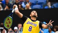 Australia's Nick Kyrgios wearing a Los Angeles Lakers jersey with former basketball player Kobe Bryant's number warms up to play against Spain's Rafael Nadal during their men's singles match on day eight of the Australian Open tennis tournament in Melbour