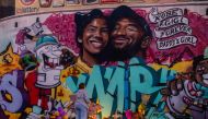 A woman looks at a mural by the artists Muck Rock and Mr79lts showing Kobe Bryant and his daughter Gianna Bryant, who were killed with seven others in a helicopter crash on January 26, in Los Angeles on January 27, 2020