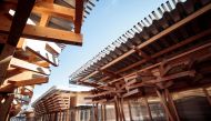 This picture shows wooden construction of the Village Plaza at the entrance of the Olympic Village in Tokyo on January 29, 2020. The organisers of the Tokyo Olympic Games unveiled the 