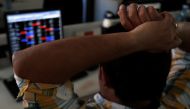 A broker reacts while trading at his computer terminal at a stock brokerage firm in Mumbai, India, February 1, 2020. (REUTERS/Francis Mascarenhas)
