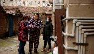 Members of a neighbourhood committee register a local and ask about his travel history in Jiujiang, Jiangxi province, China, as the country is hit by an outbreak of novel coronavirus. February 2, 2020. Reuters/Thomas Peter
 