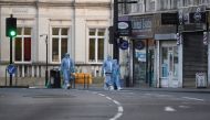 Police forensic officers are seen near the site where a man was shot by armed officers in Streatham, south London, Britain, February 3, 2020 REUTERS/Toby Melville