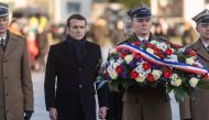 French President Emmanuel Macron takes part in a wreath laying ceremony at the tomb of the Unknown Soldier, on February 3, 2020 in Warsaw, Poland. AFP / Wojtek Radwanski 
 