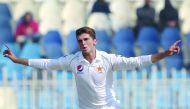 Pakistan's Shaheen Shah Afridi celebrates after taking the wicket of Bangladesh's Mominul Haque (unseen) during the first day of the first cricket Test match between Pakistan and Bangladesh at the Rawalpindi Cricket Stadium in Rawalpindi on February 7, 20